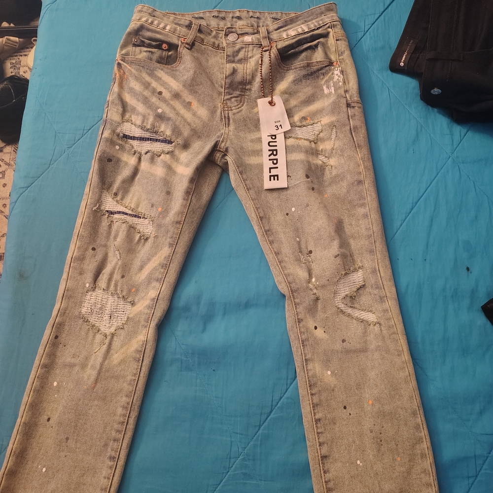 Trendy Light Blue Distressed Jeans with Paint Splatter
